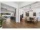 Open concept dining room with hardwood floors and a chandelier at 2172 Temple Dr, Winter Park, FL 32789