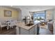 Open kitchen features an island, stainless steel appliances, and white cabinets at 2223 Tongass Bnd, Davenport, FL 33896