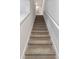 Carpeted stairs leading to the upper level of the home at 2223 Tongass Bnd, Davenport, FL 33896