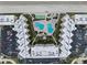 Overhead shot of condominium complex with a swimming pool, tennis court, and ample parking at 2401 S Atlantic Ave # C306, New Smyrna Beach, FL 32169