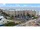 Aerial view of beachfront condo building with parking and ocean views at 2401 S Atlantic Ave # C306, New Smyrna Beach, FL 32169