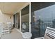 Balcony with ocean view and seating area at 2401 S Atlantic Ave # C306, New Smyrna Beach, FL 32169