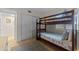 Bedroom with bunk beds and adjacent bathroom at 2401 S Atlantic Ave # C306, New Smyrna Beach, FL 32169