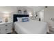 Bright bedroom featuring a comfortable bed and stylish decor at 2401 S Atlantic Ave # C306, New Smyrna Beach, FL 32169