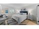 Main bedroom with a king-size bed and coastal decor at 2401 S Atlantic Ave # C306, New Smyrna Beach, FL 32169