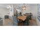 Bright dining room with wooden table and coastal decor at 2401 S Atlantic Ave # C306, New Smyrna Beach, FL 32169