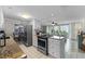 Well-equipped kitchen with granite counters and white cabinets at 2401 S Atlantic Ave # C306, New Smyrna Beach, FL 32169