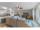 Bright living room with sectional sofa and open kitchen at 2401 S Atlantic Ave # C306, New Smyrna Beach, FL 32169