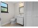 Small bathroom with white vanity and toilet at 2660 Bent Hickory Cir, Longwood, FL 32779