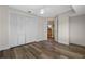 Bedroom with wood-look floors and built-in closet at 2660 Bent Hickory Cir, Longwood, FL 32779