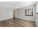 Spacious bedroom with wood-look floors and window at 2660 Bent Hickory Cir, Longwood, FL 32779