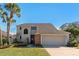 Attractive two-story home with a large garage and well-manicured lawn at 2660 Bent Hickory Cir, Longwood, FL 32779