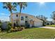 Two-story home with attractive landscaping and a two-car garage at 2660 Bent Hickory Cir, Longwood, FL 32779