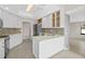 Modern kitchen with white cabinets, stainless steel appliances and an island at 2660 Bent Hickory Cir, Longwood, FL 32779