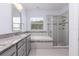 Elegant bathroom with granite vanity and walk-in shower at 2918 Sand Oak Loop, Apopka, FL 32712