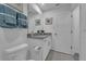 Bathroom with granite countertop, toilet and a view of another room at 3330 Thicket St, Tavares, FL 32778