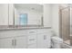 Bathroom boasts double vanity with granite countertop at 3330 Thicket St, Tavares, FL 32778