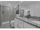 Elegant bathroom with double vanity and large walk-in shower at 3330 Thicket St, Tavares, FL 32778
