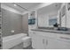 Clean bathroom with a bathtub, toilet, and granite countertop at 3330 Thicket St, Tavares, FL 32778