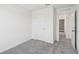 Bedroom with grey carpet and access to another room at 3330 Thicket St, Tavares, FL 32778