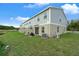 Townhouse exterior with private patio and pond view at 3330 Thicket St, Tavares, FL 32778