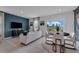 Open living room and dining area with modern furnishings and view of backyard at 3330 Thicket St, Tavares, FL 32778