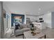 Open concept living room with kitchen, island, and access to outdoor space at 3330 Thicket St, Tavares, FL 32778