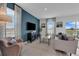 Bright and airy living room with comfortable seating and access to a patio at 3330 Thicket St, Tavares, FL 32778