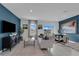 Open living space with a sofa, accent chairs, and a dining table at 3330 Thicket St, Tavares, FL 32778
