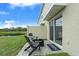 Relaxing patio with fire pit and view of pond at 3330 Thicket St, Tavares, FL 32778