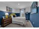 Bedroom with a full-size bed and colorful decor at 3332 Thicket St, Tavares, FL 32778