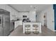 Modern kitchen with island, stainless steel appliances, and white cabinets at 3332 Thicket St, Tavares, FL 32778