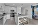 Modern kitchen with island and blue accent wall at 3332 Thicket St, Tavares, FL 32778