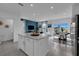 Open concept kitchen with island and view of backyard at 3332 Thicket St, Tavares, FL 32778