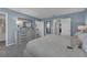 Main bedroom with dresser and view into the bathroom at 3332 Thicket St, Tavares, FL 32778