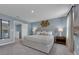 Main bedroom with plush bed, large mirror, and carpeted floor at 3332 Thicket St, Tavares, FL 32778