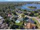 Aerial view showcasing a home's location near a lake and city skyline at 3907 Dekalb Dr, Orlando, FL 32839