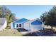 House with blue accents and solar panels, on a residential street at 429 Copperstone Cir, Casselberry, FL 32707