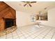 Living room features a wood-burning fireplace and tile floors at 429 Copperstone Cir, Casselberry, FL 32707
