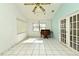 Sunroom features tile floors and French doors at 429 Copperstone Cir, Casselberry, FL 32707