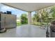 Covered patio with large backyard and storage cabinet at 433 Carolina Ave, Winter Park, FL 32789