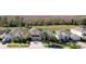 House with solar panels, pool, and lush landscaping in a community setting at 437 Prestwick Dr, Davenport, FL 33897