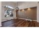 Dining room with hardwood floors, large window, and neutral wall color at 437 Prestwick Dr, Davenport, FL 33897