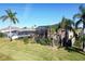 House with solar panels and screened pool, nestled in tropical landscaping at 437 Prestwick Dr, Davenport, FL 33897