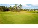 Scenic putting green with lush landscaping at 437 Prestwick Dr, Davenport, FL 33897