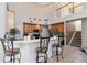 Kitchen features wood cabinets, stainless steel appliances, and breakfast bar at 437 Prestwick Dr, Davenport, FL 33897