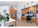 Open concept kitchen with ample counter space and wood cabinets at 437 Prestwick Dr, Davenport, FL 33897