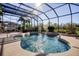 Inviting screened pool with a fountain, surrounded by tropical plants at 437 Prestwick Dr, Davenport, FL 33897