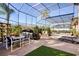 Spacious screened-in pool area with lounge chairs and seating at 437 Prestwick Dr, Davenport, FL 33897