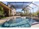 Large screened pool with a fountain and plenty of space for lounging at 437 Prestwick Dr, Davenport, FL 33897